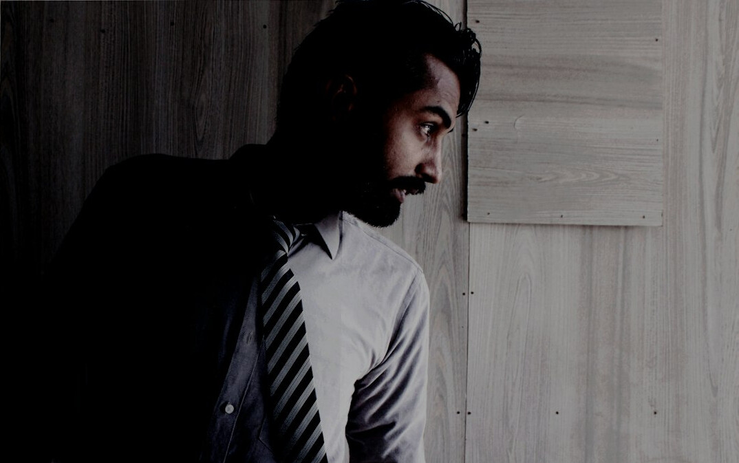 Portrait of a bearded man in a collared shirt